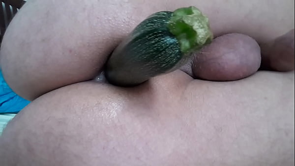 Putting a big zucchini up the ass